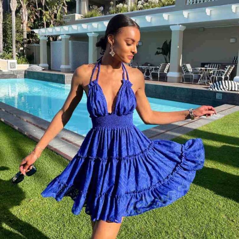 Girl wearing a navy blue halter-neck dress