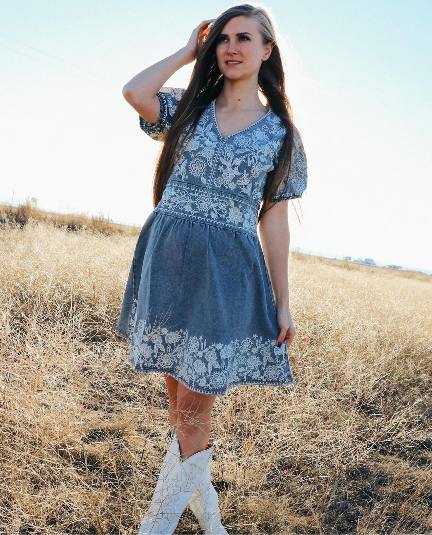 Audrey wearing a breezy blue floral dress