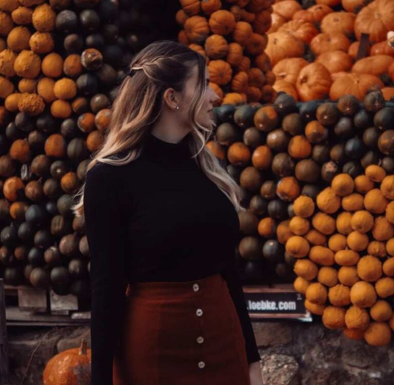 A black turtleneck pairs perfectly with a rust-colored button-front skirt