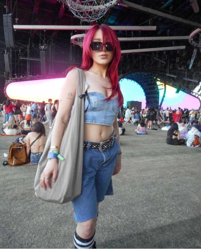 Niki wearing a A denim crop top with denim bermuda shorts