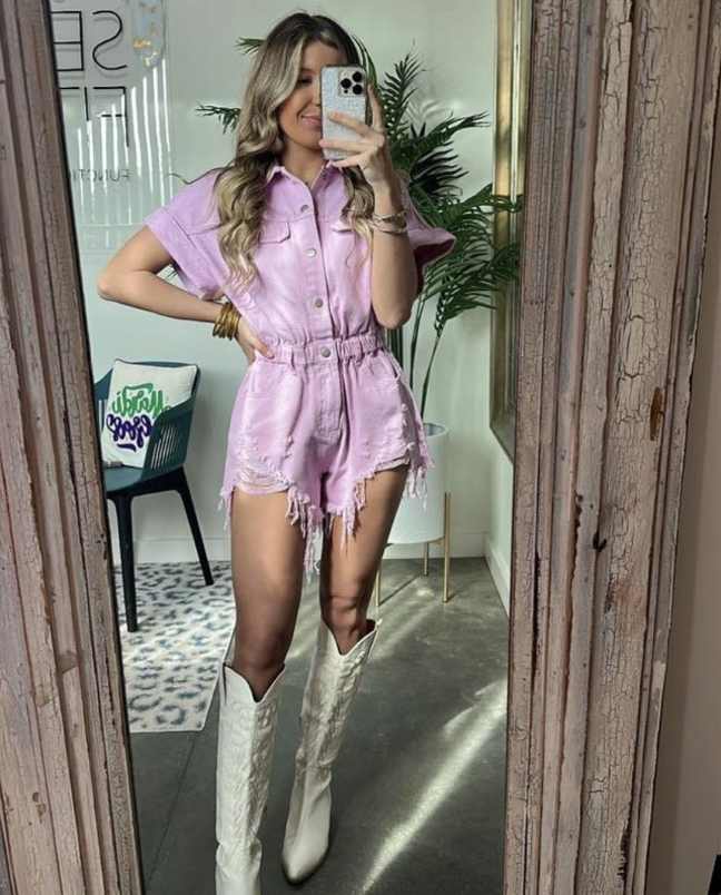 Girl wearing A cute lavender button-up romper