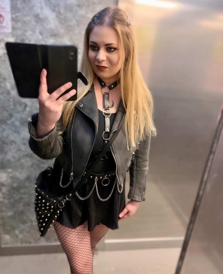 catharina wearing a black leather jacket over a black shirt and black skirt