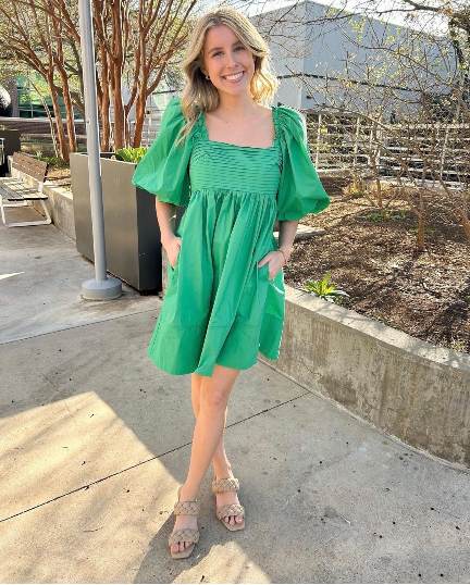 girl wearing a bright green flowy dress