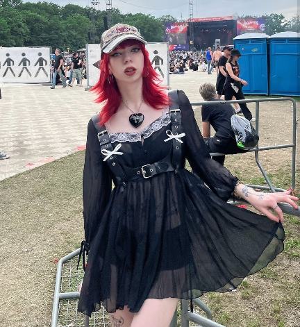 alicia wearing A sheer black dress with lace and ribbon details