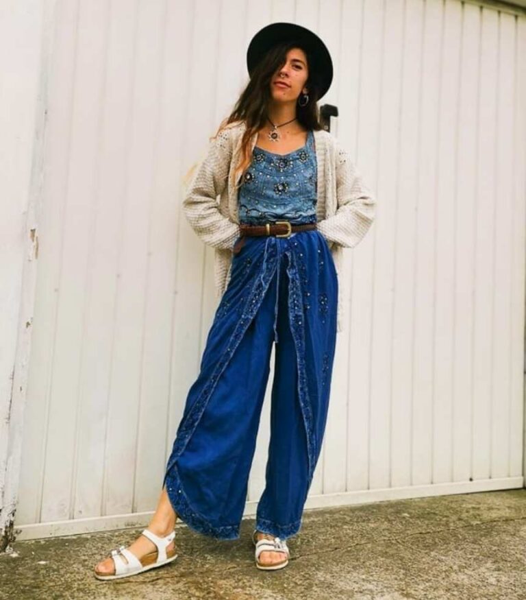 girl wearing a flowy blue top with some flowy wide-leg pants