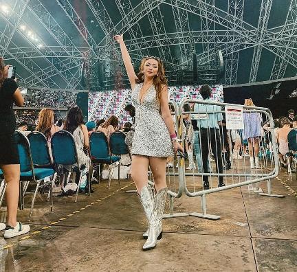 melanie wearing A shimmering silver mini dress