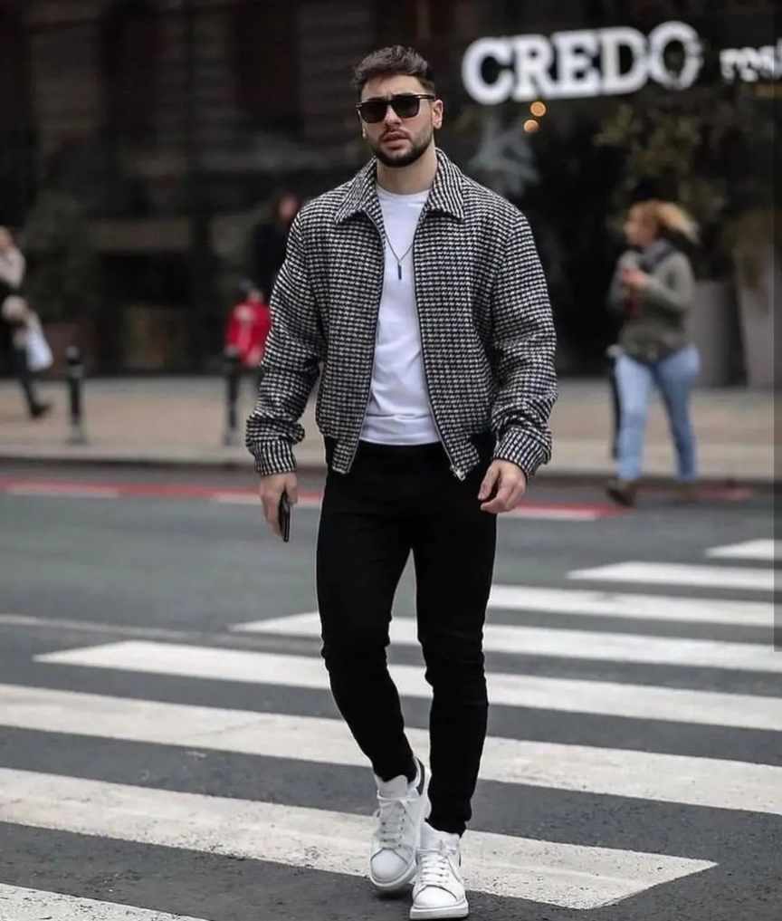 guy wearing a black and white checkered jacket over a classic white tee paired with black skinny jeans