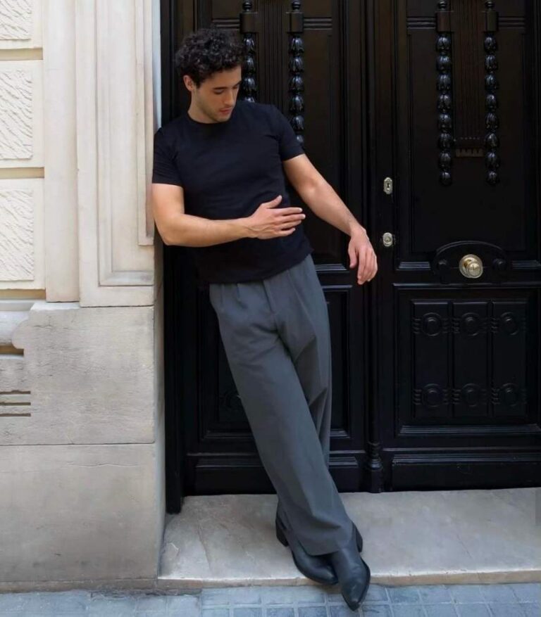 ivan wearing a fitted black T-shirt with loose gray trousers