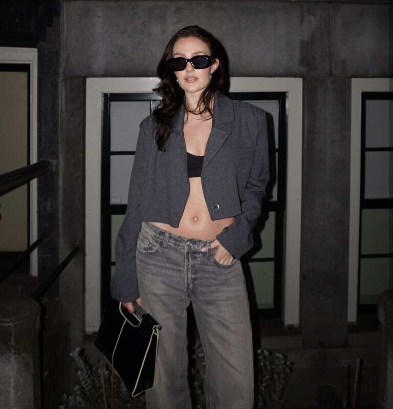 ola wearing a black crop top paired with oversized gray jeans and a dark gray cropped blazer