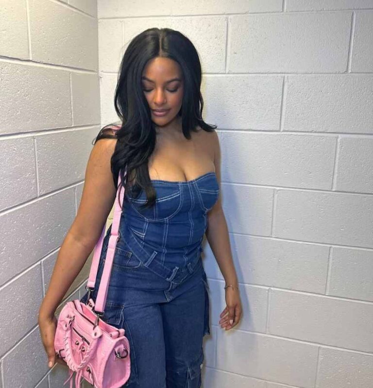 taina wearing A strapless denim dress