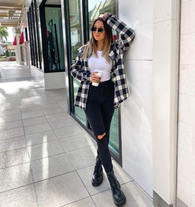 girl wearing A black-and-white oversized buffalo plaid flannel over a crisp white fitted top while black ripped skinny jeans