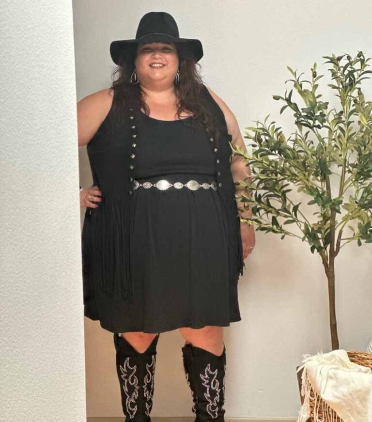 plus size girl wearing a sleeveless dress with a fringe vest